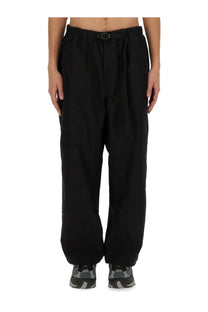 Carhartt Wip men’s black belted pants with elastic waistband and black buckle in loose fit design