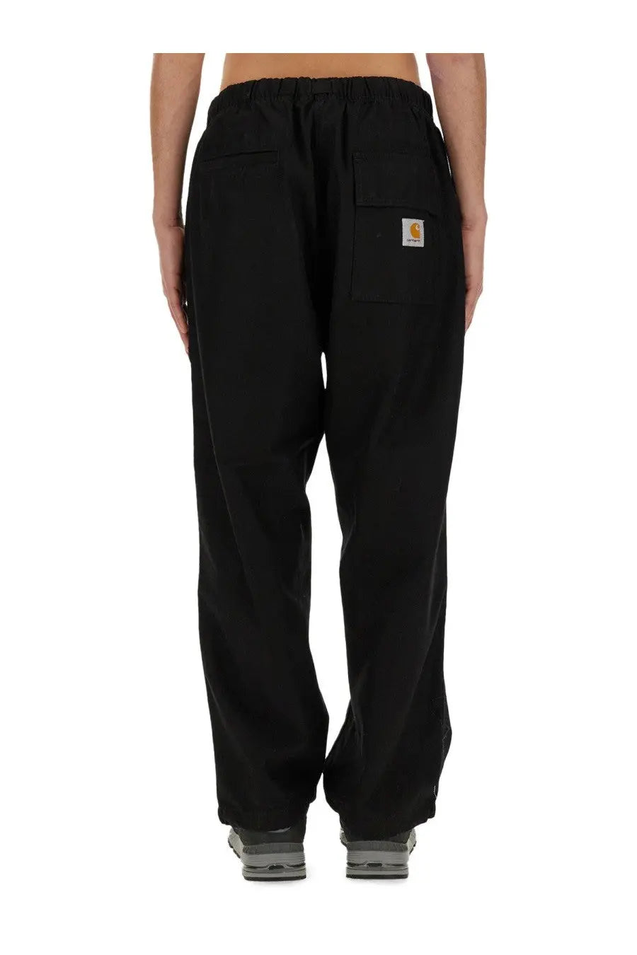 Carhartt wip men’s black pants with drawstring waist and front pockets made of durable fabric
