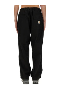 Carhartt wip men’s black pants with drawstring waist and front pockets made of durable fabric
