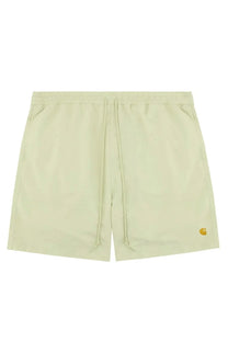 Light green carhartt wip men’s boxer swimsuit with drawstring and yellow logo on lower right leg for swimming