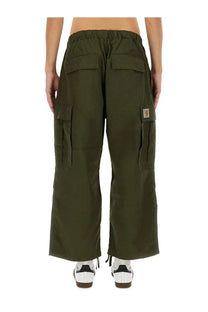 Carhartt wip men’s olive green cargo pants with multiple pockets and elastic waistband made from durable fabric
