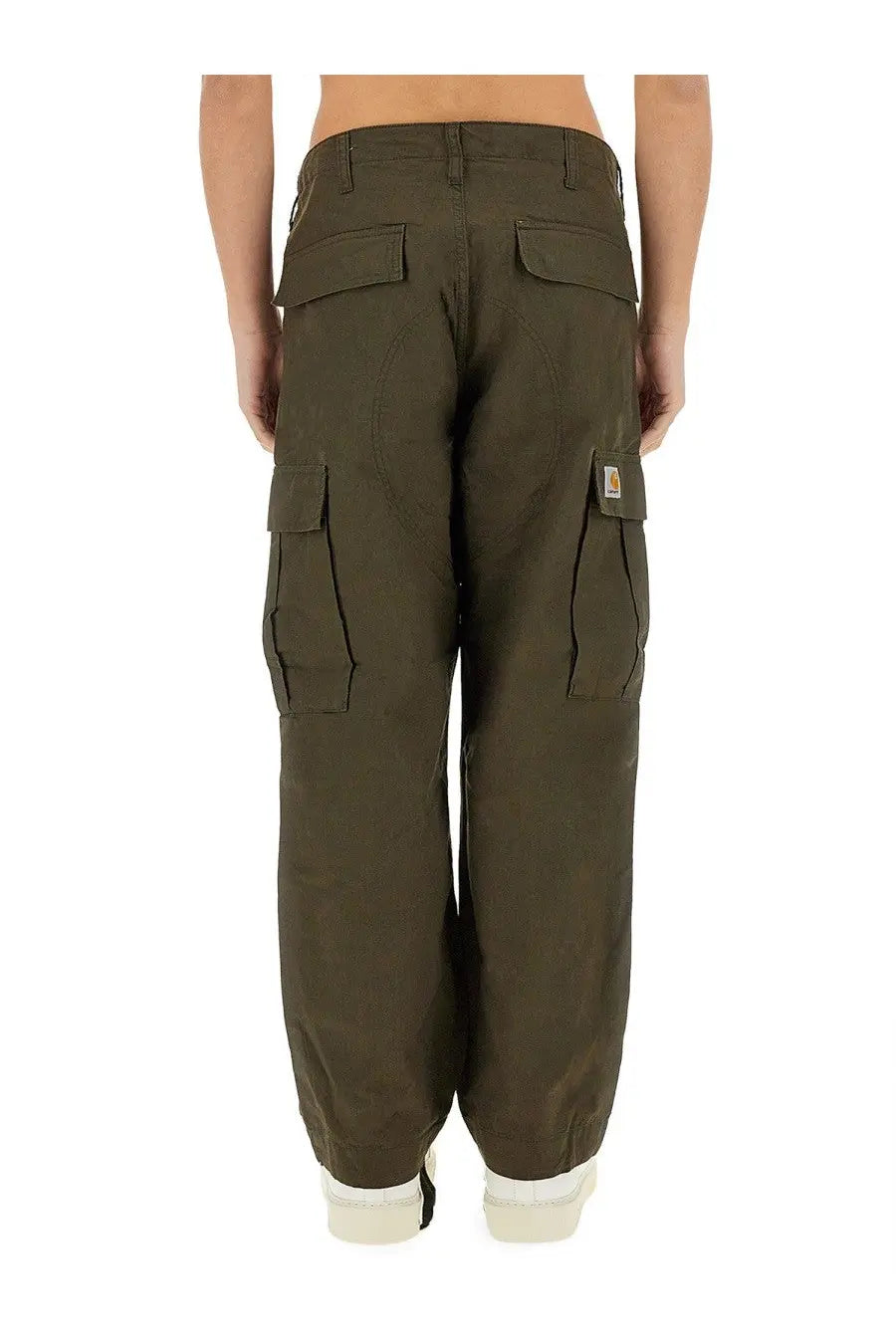 Carhartt Wip men’s olive green cargo pants with multiple pockets and a logo patch on the thigh