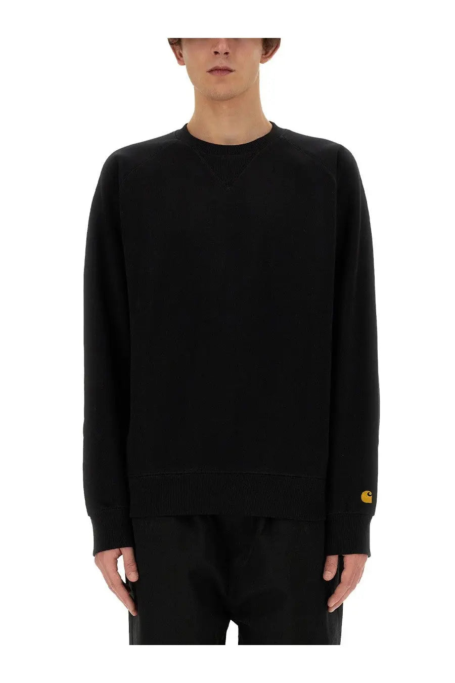 Carhartt Wip men’s black cotton chase sweatshirt with a small yellow logo on the left sleeve