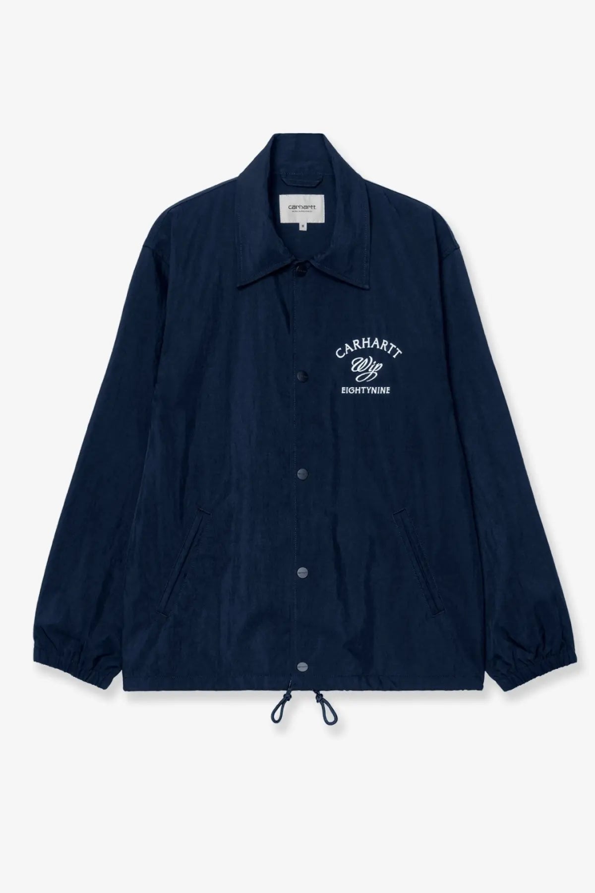Navy blue Carhartt Wip men’s Eightynine coach jacket with white embroidered logo and button closures in nylon