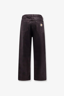 Back view of carhartt wip men’s everson bradford cotton trousers in black with dark brown wide-leg design and logo patch