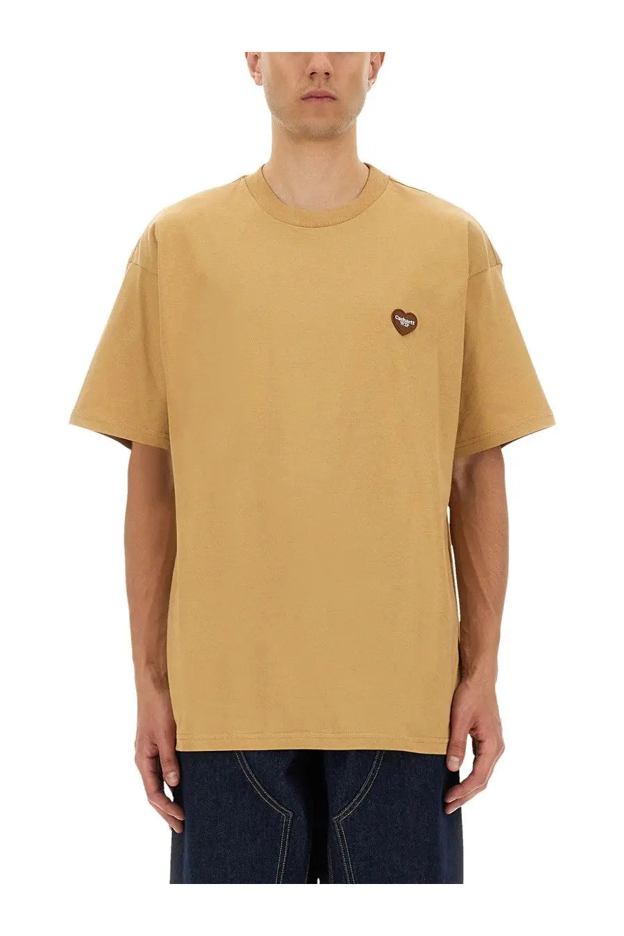 A mustard yellow oversized cotton t shirt with a small brown heart shaped patch by carhartt wip men beige