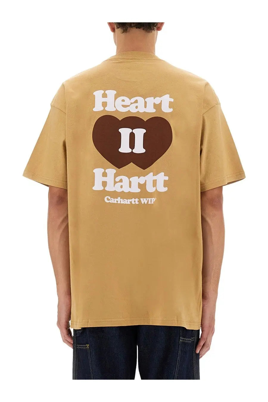 Tan Carhartt Wip Men’s Heart II Hartt shirt beige with a bold brown heart graphic and white lettering