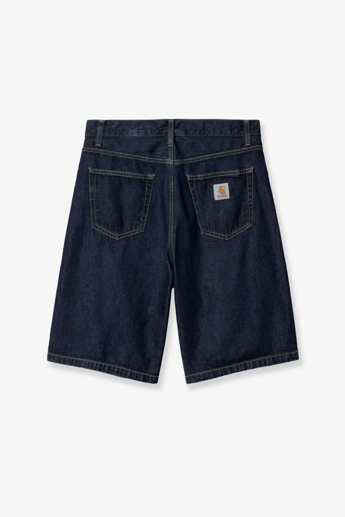 Back side of dark indigo carhartt wip men’s landon denim bermuda shorts with classic logo patch on pocket