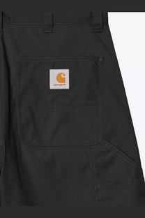 Black carhartt wip men’s postal dk cotton blend bermuda shorts with white label and orange logo on front pocket