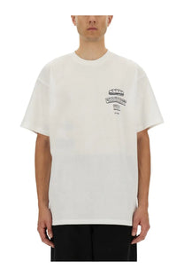 White oversized crewneck t-shirt with black embroidered crown and text logo on left chest by carhartt wip