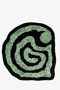 A plush circular bath mat with a swirling green and black abstract maze pattern from carhartt wip unisex helix rug carpet black
