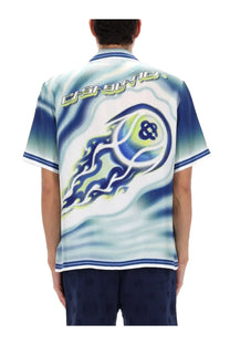 Blue and white graphic polo shirt with swirling flame design and stylized casino lettering on the back side