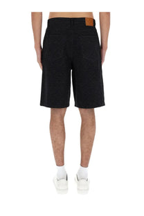 Black denim Casablanca men’s laser monogram shorts showing the back with a brown leather patch at the waistband