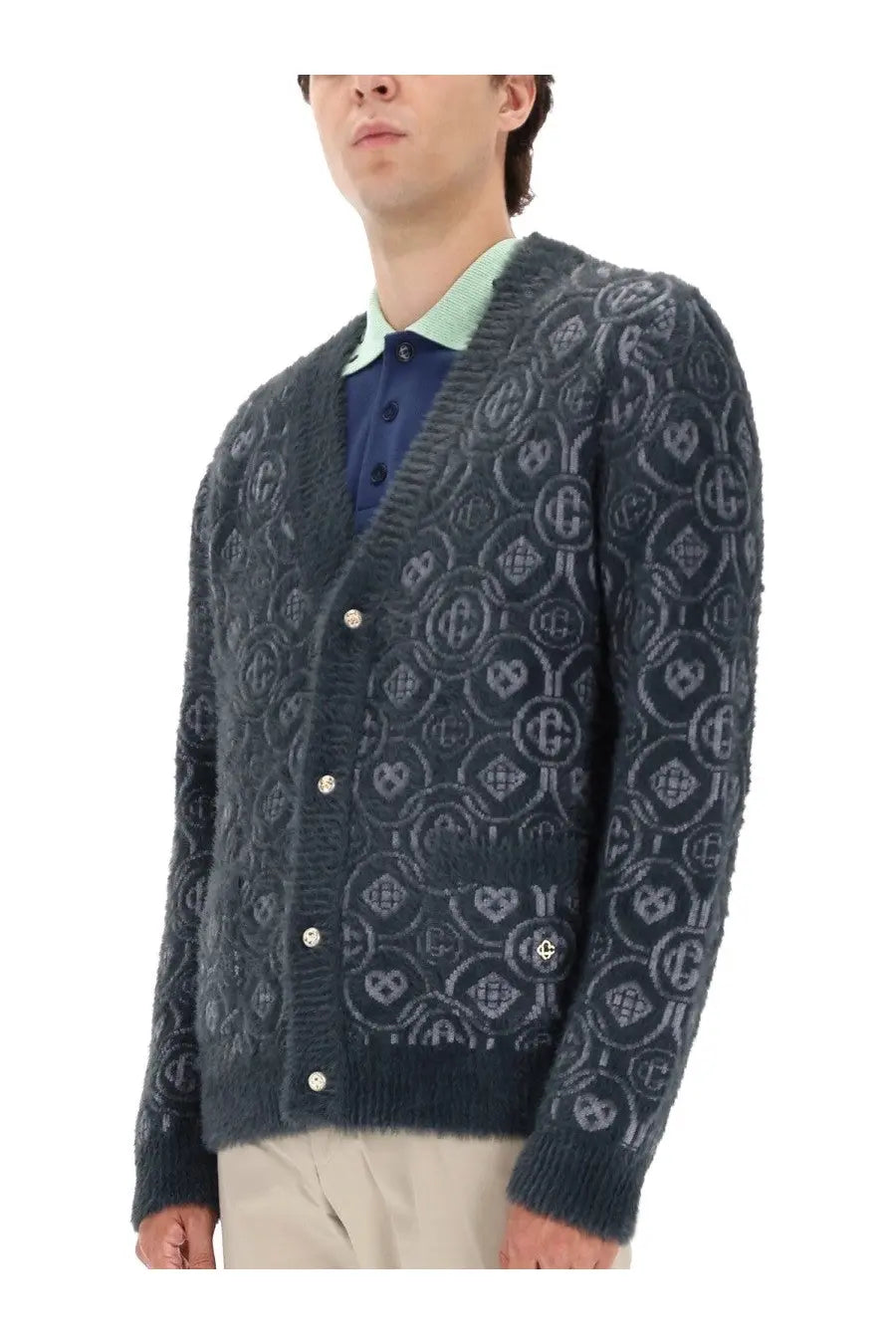 Dark gray textured knit cardigan with intricate interlocking geometric and heart patterns in a lighter shade