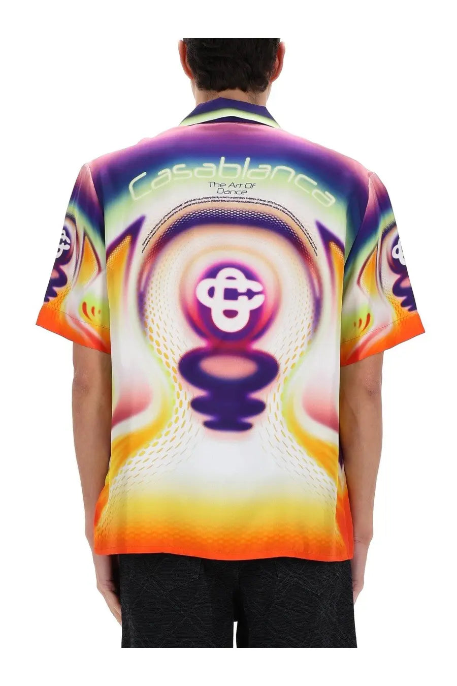 Back of a casablanca men’s printed shirt with psychedelic swirl design in purple orange yellow and white text