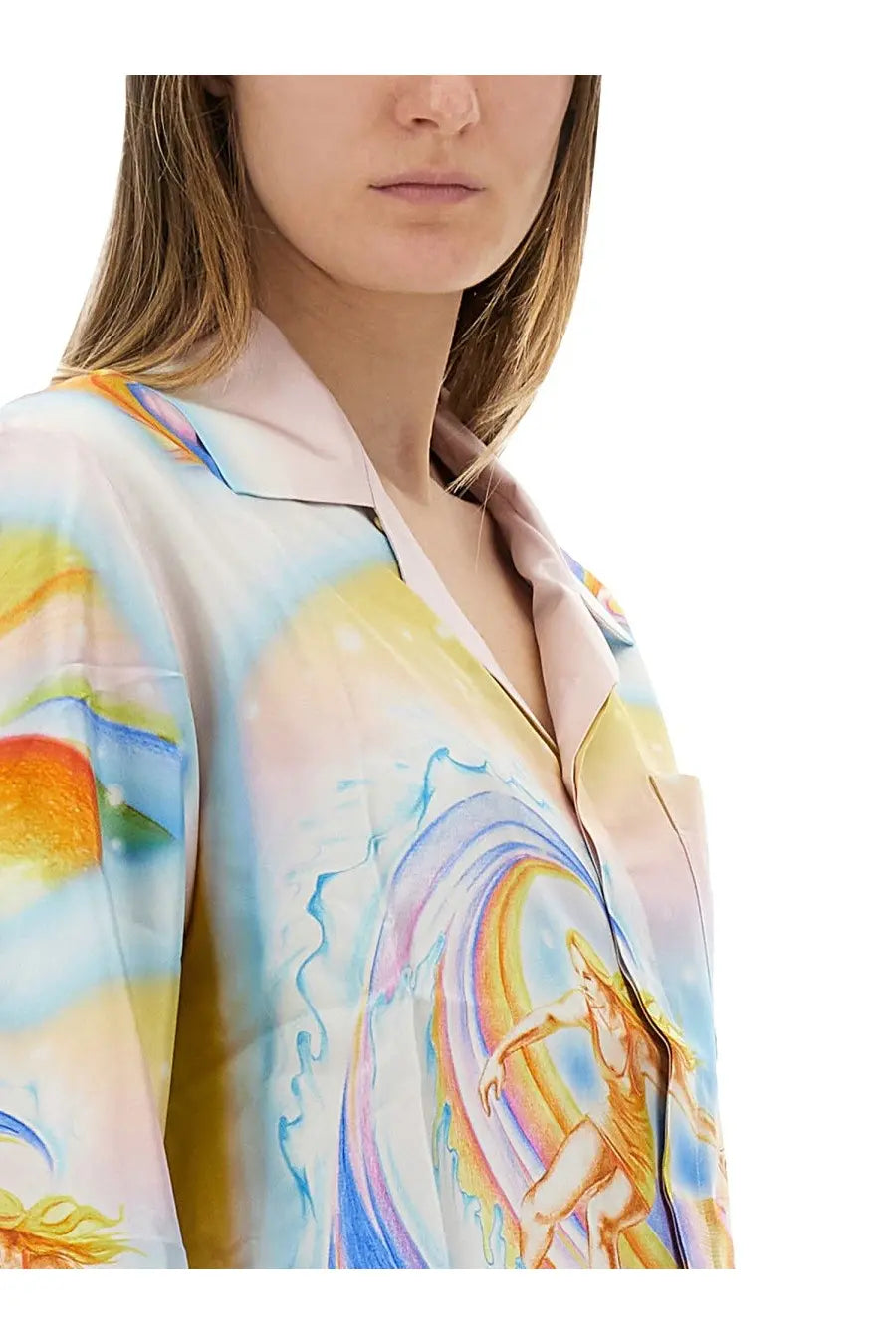 A flowing light pink silk pajama top with a vibrant surfer print on a rainbow wave from casablanca women’s psychedelic nirvana shirt