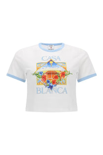 White cropped cotton t-shirt with light blue trim and colorful casa blanca tennis graphic featuring flowers and sun