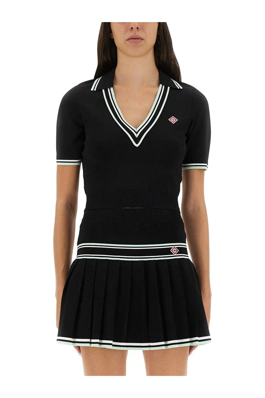 Casablanca women’s black viscose knit polo dress with white and light green striped v-neck collar and pleated skirt