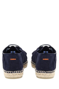 Navy blue suede Castañer men’s espadrille Ned with woven jute soles and orange branding on the back heel