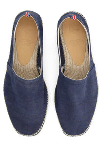 Navy blue canvas espadrilles with woven jute sole and red white and blue heel trim by castañer men’s espadrille pablo blue