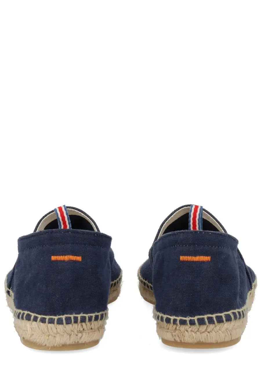 Navy blue canvas espadrille slip-on shoes with woven jute sole and striped heel tab shown from the back side