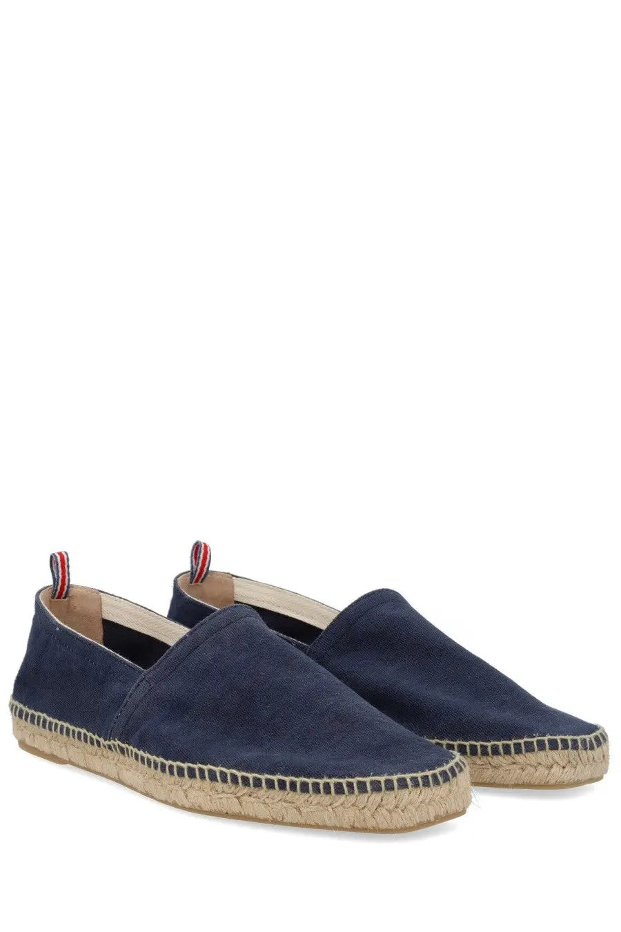 Navy blue suede espadrille slip-on shoes with woven jute sole and red white and blue pull tabs from castañer men’s espadrille pablo blue