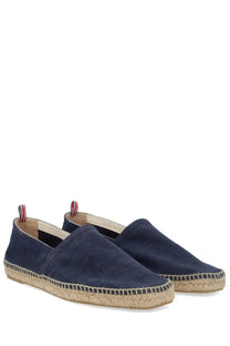 Navy blue suede espadrille slip-on shoes with woven jute sole and red white and blue pull tabs from castañer men’s espadrille pablo blue