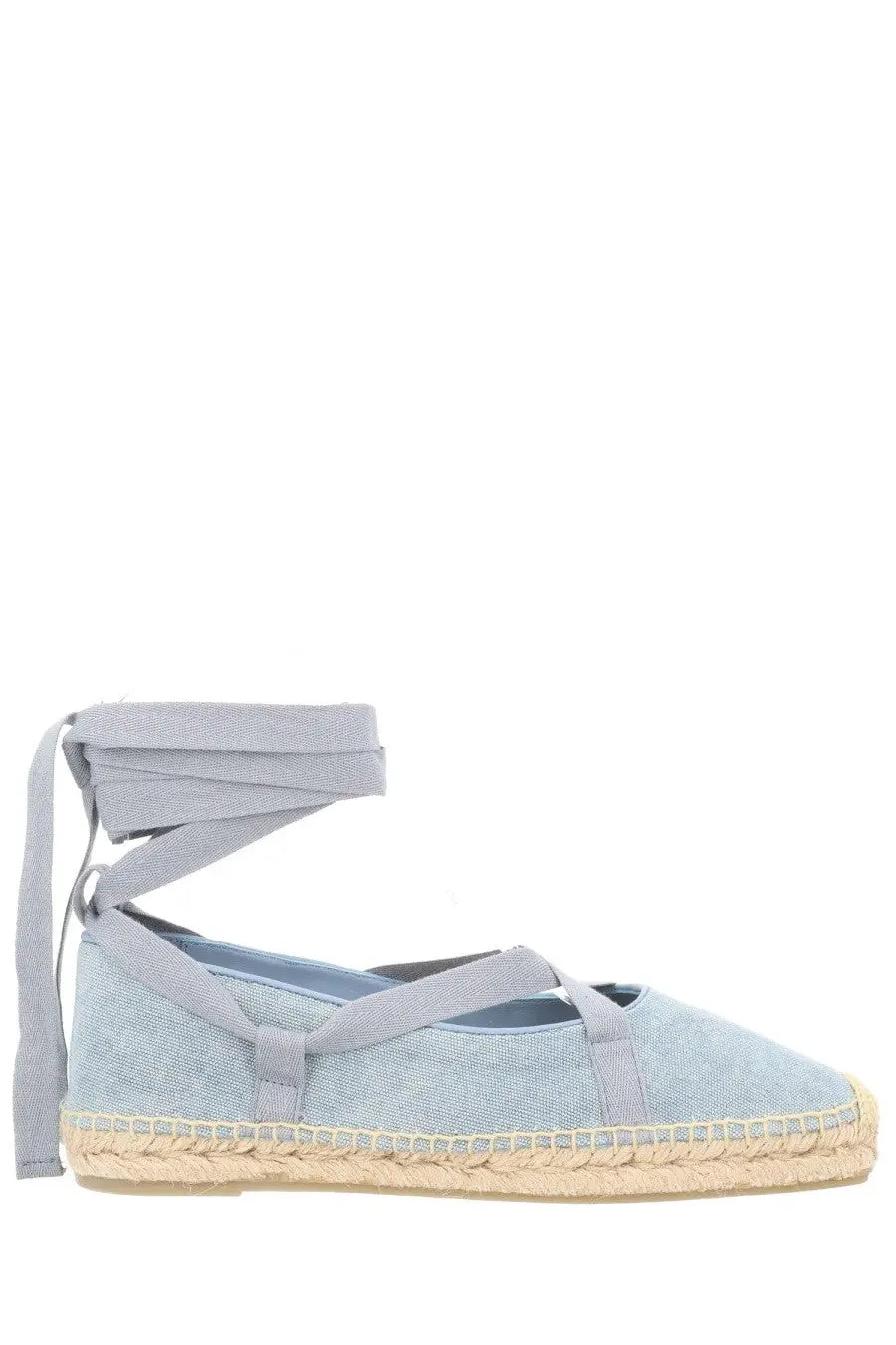 Light blue canvas espadrilla flats with woven jute soles and ankle straps from Castañer women’s collection