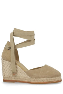 Beige suede espadrille wedge sandal with woven jute heel and ankle strap from castañer women’s camila collection