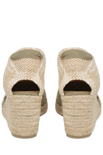 Beige woven espadrille wedge sandals with olive green fabric accents from Castañer Women’s Espadrille Carina Green