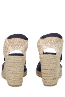 Castañer women’s espadrille wedge sandals in navy blue and beige with braided rope heel made of woven material