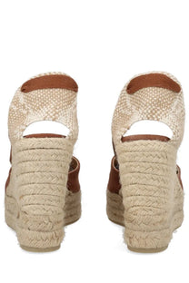 Beige woven espadrille wedge sandals with brown leather accents and braided rope heel from Castañer women’s espadrille cute brown