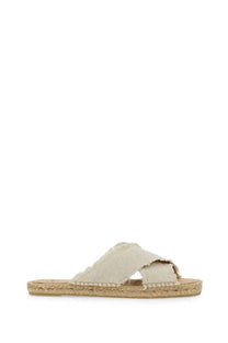 Beige canvas espadrille slide sandal with woven jute sole and frayed edges from Castañer Women’s Palmera White collection
