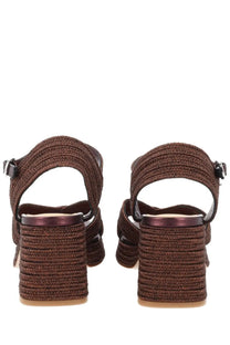 Castañer women’s brown woven straw sandals with chunky heel and black buckle straps