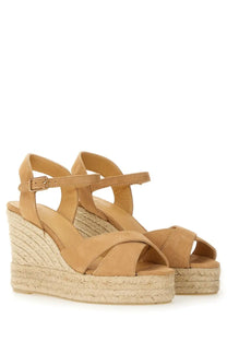 Castañer women’s beige wedge sandal in tan suede with woven jute platform and adjustable ankle strap