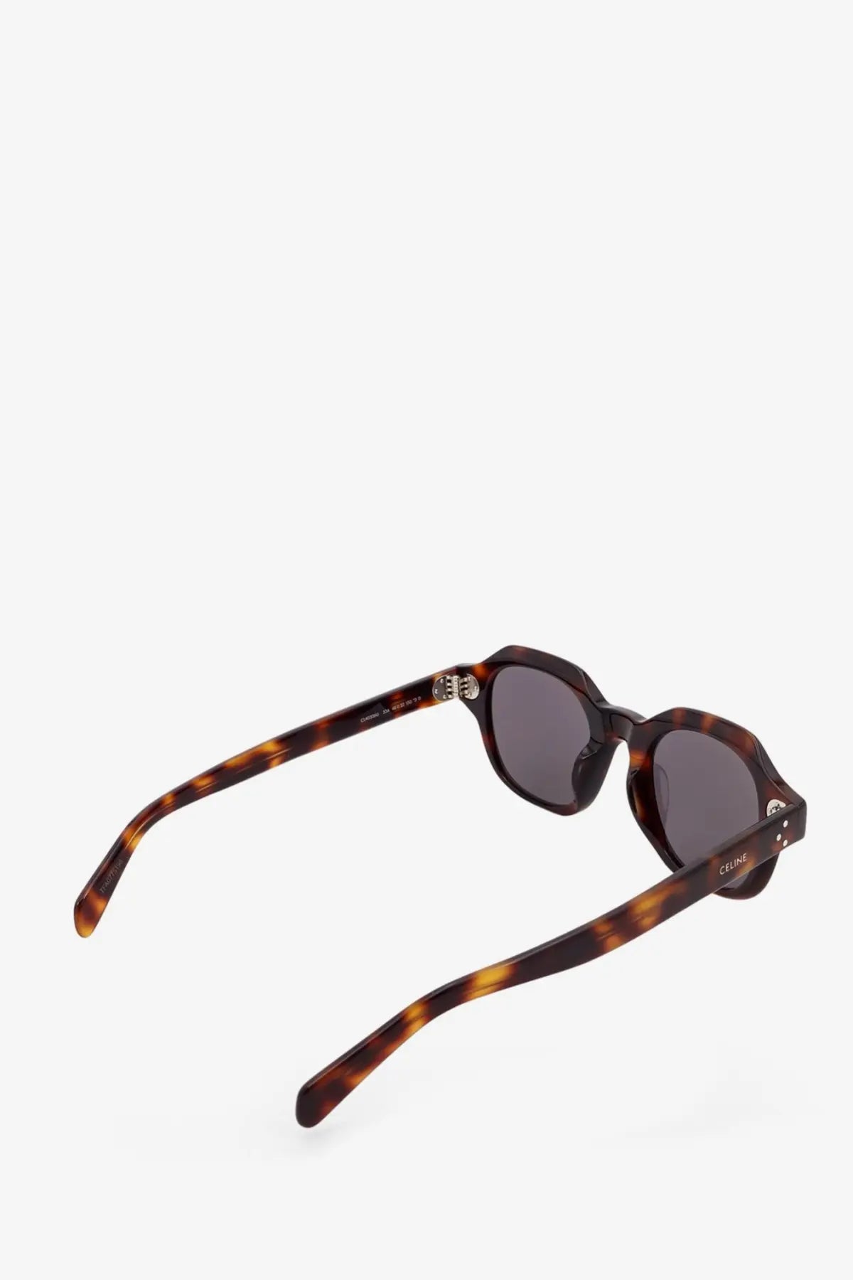 Celine men’s tortoiseshell acetate sunglasses with dark gray lenses and metallic hardware in white product line