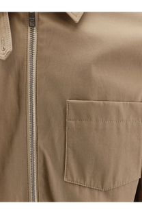 Celine men’s beige cotton trench coat with silver zipper and matching pocket featuring subtle stitching details