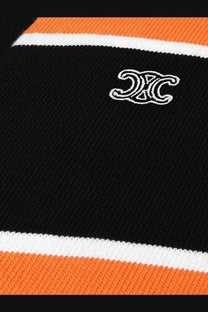 Celine men’s black cotton polo shirt with black and orange striped knit sweater and white embroidered logo