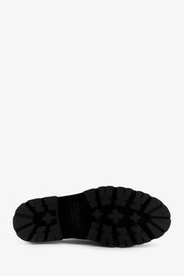 Black rubber sole with deep rugged tread and embossed brand logo on Celine men’s derby Margaret leather lace up shoes