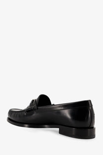 Black leather Celine men’s Luco loafers with polished finish and decorative tassel at the front