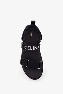 Black celine men’s sandali in tela jacquard with bold white logo straps and metallic buckles