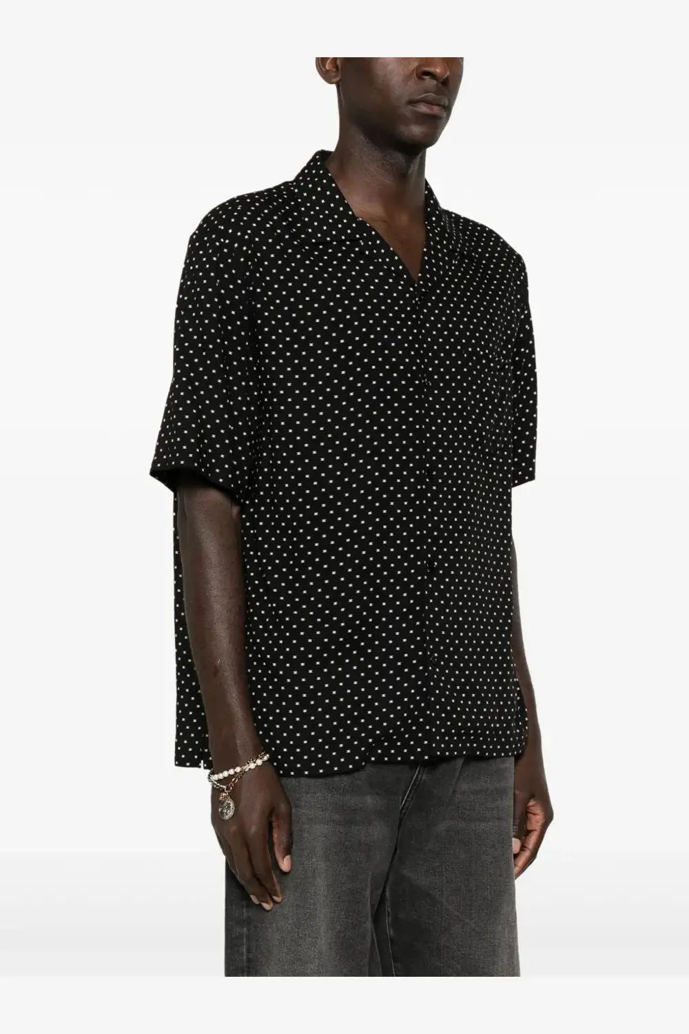 Celine men’s black short-sleeved button-up viscose shirt with subtle white polka dot pattern