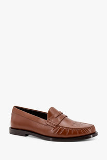 Celine men’s vivienne brown leather loafer with polished finish decorative perforated toe and frayed vamp edges