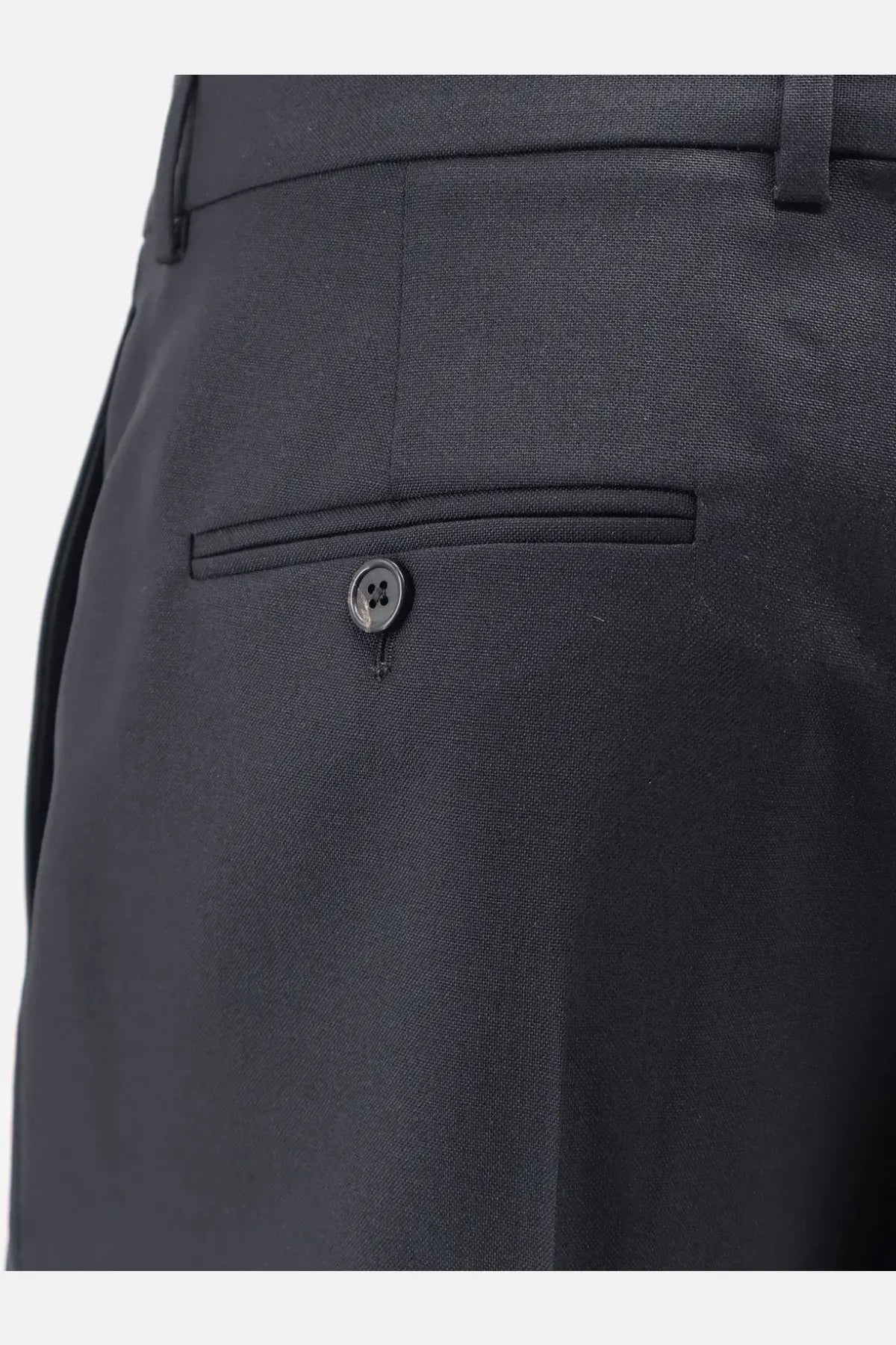 Back side of celine men’s dark gray textured wool and mohair trousers with single button closure on back pocket