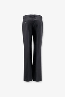 Celine men’s black wool and mohair trousers with a sleek tailored fit and subtle stitching details