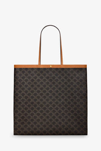 Black celine unisex triomphe fabric shopper bag miel with repeating monogram pattern and tan leather handles