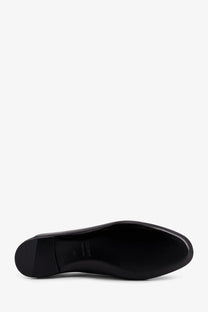 Celine women’s aura slip on leather loafers in black with sleek minimalist design and smooth glossy finish