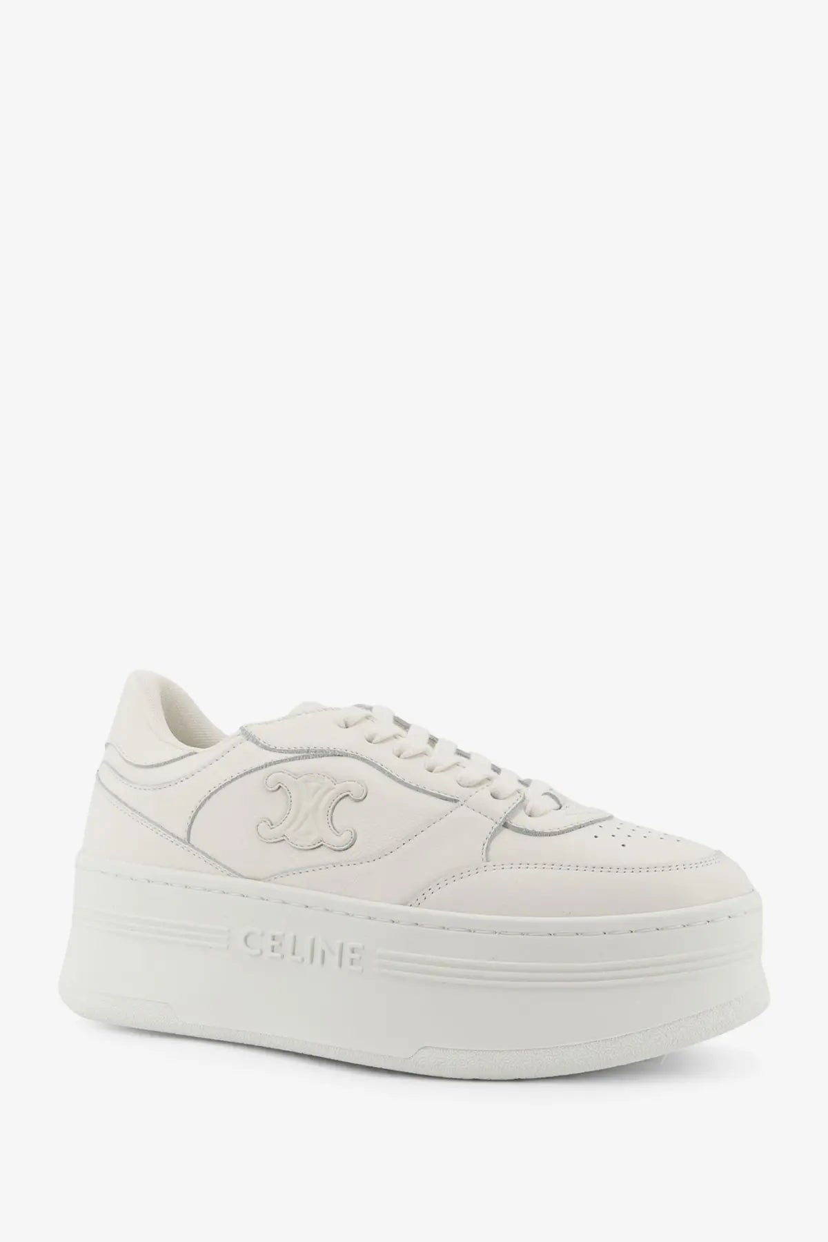 White celine women’s block sneaker featuring a sleek leather upper and embossed logo on the side