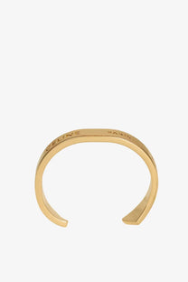 Gold-tone celine paris brass cuff bracelet with sleek minimalist design and engraved branding for women