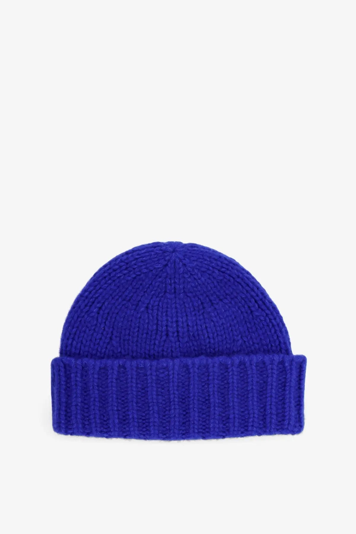 A vibrant royal blue ribbed knit beanie with folded cuff in cashmere and silk from Celine women’s Triomphe hat collection